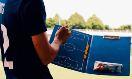 What is the role of a soccer coach?
